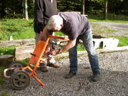 Mike Wilson fixing the cement mixer engine