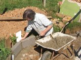 Tony Audsley building the retaining wall (Photo (C) Ian Gregory)